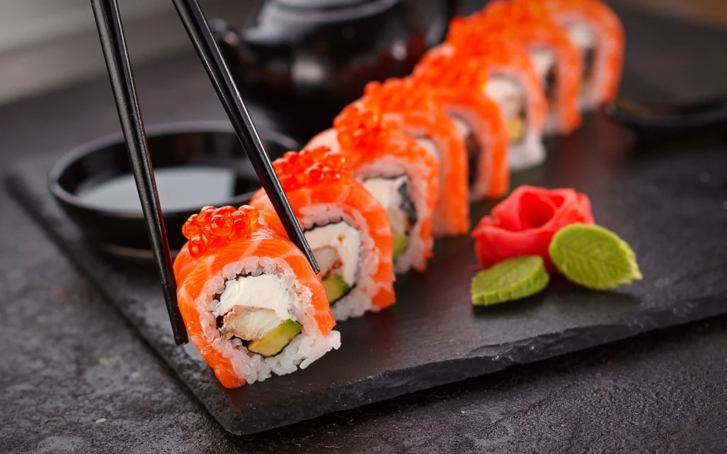 Sushi platter along with green tea shot